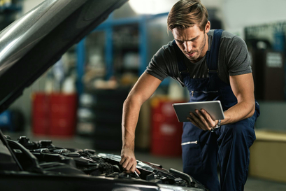 Man inspecting car damage